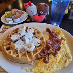 D Lux Diner - The 2-2-2: waffle with banana, chocolate chips, and coconut, 2 eggs, and bacon