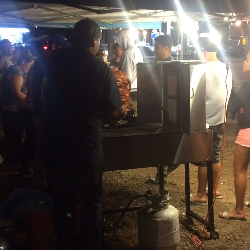 Tons O’ Topping Tacos - This photo was taken at 10:01 PM and the guy hadn't yet set up the trumpo. - Tacos Near Me