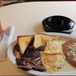 Fuegos Restaurant - Long shot of my "Huevos Fuegos" breakfast, showing the main plate, the tortillas and the red and green sauce.