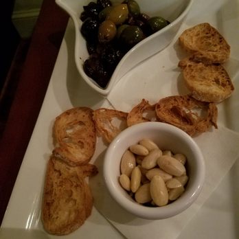 Vin 909 - Olives and Almonds. Warm olives with crunchy toastini and Almonds - New American Near Me - Annapolis, Maryland Vin 909 - Olives and Almonds. Warm olives with crunchy toastini and Almonds - New American Near Me - Annapolis, Maryland