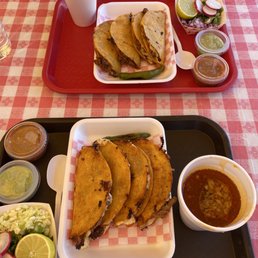 Birria tacos with a side of consome. Birria tacos with a side of consome.