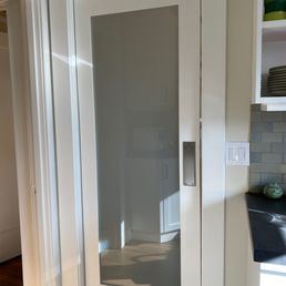 Internal swinging kitchen door with glass panel.