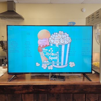 THE POPCORN SPOT - a flat screen television on a table - Popcorn Shops Near Me - RIVERVIEW, Florida THE POPCORN SPOT - a flat screen television on a table - Popcorn Shops Near Me - RIVERVIEW, Florida