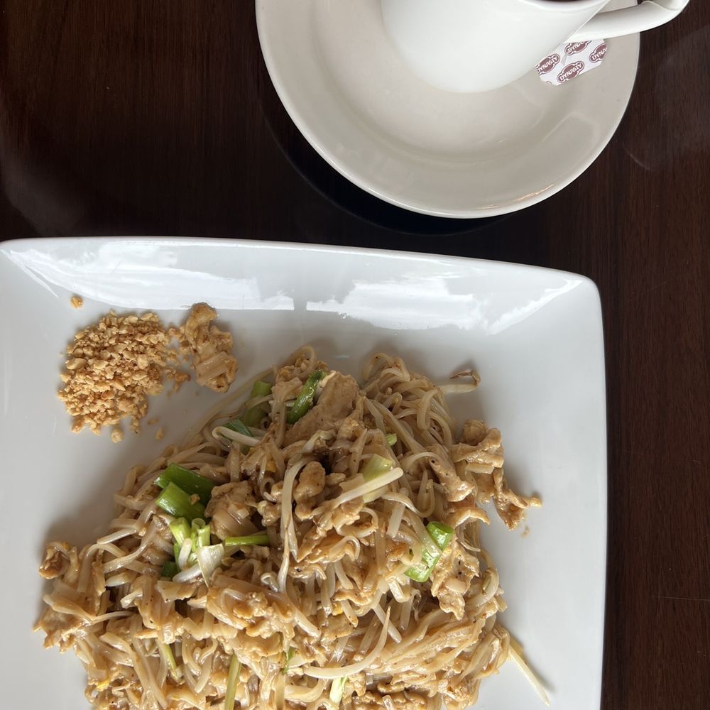 a plate of noodles and a cup of coffee a plate of noodles and a cup of coffee