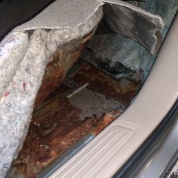 Rust through hole in floor board. Rust through hole in floor board.
