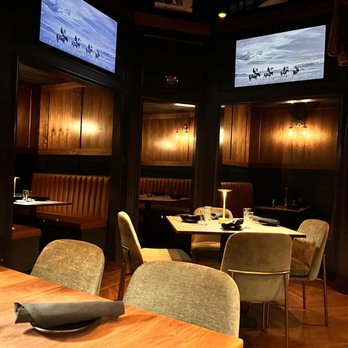 Coat Room - a dining area with wooden tables and chairs - Speakeasies Near Me - Saratoga Springs, New York Coat Room - a dining area with wooden tables and chairs - Speakeasies Near Me - Saratoga Springs, New York