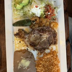 El Potro Mexican Restaurant - Ribeye Y Camaron:  Ribeye, jalapeño, sautéed shrimp, frijoles, arroz a la Mexicana, avocado salad with sour cream.  Delicious!