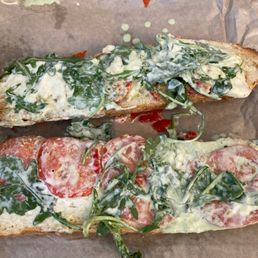 Literally tomatoes, greens, sauce and cheese...