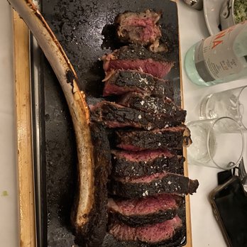 One 10 - Steak on special, tomahawk ribeye steak on sizzling plate - Desserts Near Me - Melville, New York