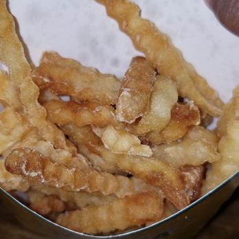 Runza - a person holding a bowl of fried food - Fast Food Near Me - Lincoln, Nebraska