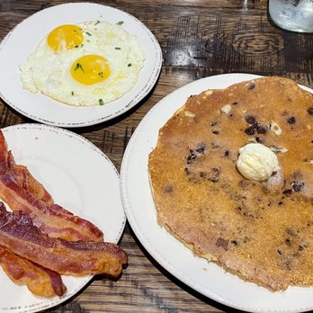 First Watch - The Multigrain Pancake, Chocolate Chip with a side of bacon and eggs. - Cafes Near Me - Tempe, Arizona First Watch - The Multigrain Pancake, Chocolate Chip with a side of bacon and eggs. - Cafes Near Me - Tempe, Arizona