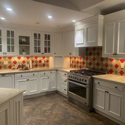 Supreme Kitchens & Baths - Before: red, white & green backsplash tile