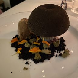 Dessert in the shape of a mushroom.  Very unique and divine.