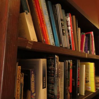 Fioza - a bookshelf with many books on it - Coffee & Tea Near Me - Houston, Texas Fioza - a bookshelf with many books on it - Coffee & Tea Near Me - Houston, Texas