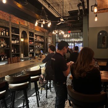 Retrobottega - a group of people at a bar - Tapas/Small Plates Near Me - Washington, DC, District of Columbia