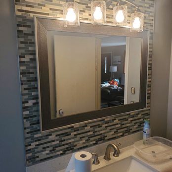 Benner Construction - a bathroom with a sink and mirror - General Contractors Near Me Benner Construction - a bathroom with a sink and mirror - General Contractors Near Me