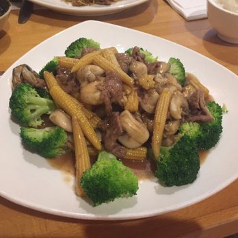 Little Saigon - Beef, broccoli, mushroom and baby corn - Thai Near Me - Springfield, Illinois Little Saigon - Beef, broccoli, mushroom and baby corn - Thai Near Me - Springfield, Illinois