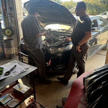 The Pit Stop Auto Repair - Shop Owner and Master Technician diagnosing a vehicle. - Auto Repair Near Me - Weatherford, Texas The Pit Stop Auto Repair - Shop Owner and Master Technician diagnosing a vehicle. - Auto Repair Near Me - Weatherford, Texas