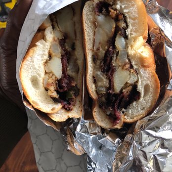 G & S American Deli - a hand holding a sandwich - Delis Near Me - Orange, New Jersey G & S American Deli - a hand holding a sandwich - Delis Near Me - Orange, New Jersey