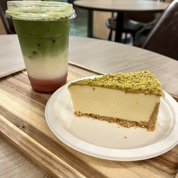 Mochaland - Iced Strawberry Matcha Latte Pistachio Cheesecake - Coffee & Tea Near Me - West Lafayette, Indiana Mochaland - Iced Strawberry Matcha Latte Pistachio Cheesecake - Coffee & Tea Near Me - West Lafayette, Indiana