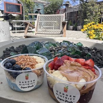 Garden District Super Foods - (Left) bowl of the month and (Right) pb&j acai - Juice Bars & Smoothies Near Me - Seal Beach, California