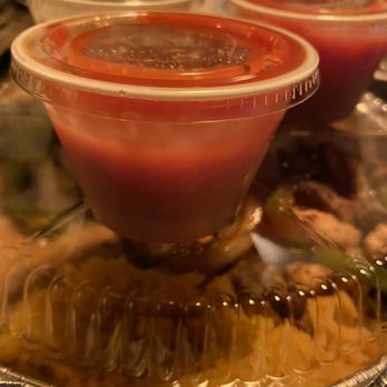 Tacos Mexico Restaurant - Two cups of salsa atop takeout container for size reference, back left cup is side of pico - Mexican Near Me - Fuquay-Varina, North Carolina