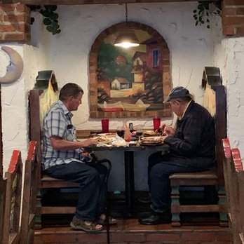 El Jimador - two men sitting at a table eating - Mexican Near Me - Maryville, Tennessee