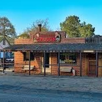 Saddle Sore - an old western building with a sign for saddle sore - American Near Me - Glennville, California