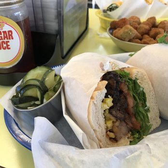 The Pig - Brisket po' boy with pickles in the side, and a side of okra. - Barbeque Near Me - Chapel Hill, North Carolina