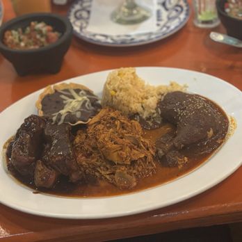 Mi Casa - Mexican combo (left to right: Los Costillas en adobo de Tamarindo, La Cochinita pibil, El Mole poblano) - Mexican Near Me - Cabo San Lucas, BCS