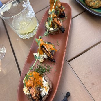 Zula Kitchen & Wine Bar - Grilled Tiger Prawns: feta-stuffed mushrooms topped with grilled tiger prawns and tomato basil sauce - Mediterranean Near Me - Edmonton, Alberta