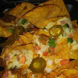 Nachos had some burnt chips, but the manager made it right Nachos had some burnt chips, but the manager made it right