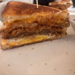 The Stanwood Cafe - 1/2 of the Chicken Fried Steak breakfast sandwich with American and no Corn beef hash