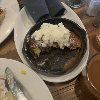 The High Hat - Skillet cinnamon roll (half eaten) - Pancakes Near Me - Saint Paul, Minnesota The High Hat - Skillet cinnamon roll (half eaten) - Pancakes Near Me - Saint Paul, Minnesota