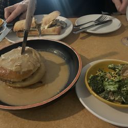 7556 Main Street Bistro - Sloppy Goodness- lamb burger with melted Provolone poured over with French onion soup and broccoli slaw.