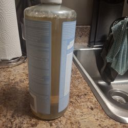 Tutti Frutti - The empty plastic bottle i poured the Dr. Bronner's soap ito it.  I used some of it ,so that is why it is not totally full.
