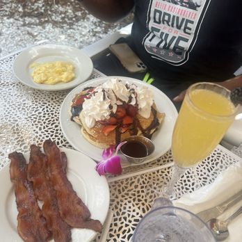 The Breakfast House - Scrambled eggs with cheese, pancakes with fruits and side of bacon and MIMOSA!!! - Breakfast & Brunch Near Me - Sarasota, Florida