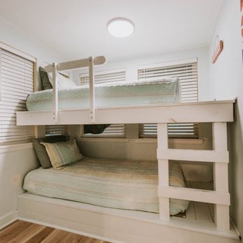 Front Beach Cottages - Twin bunk beds in second bedroom with smart tv in Bellande Cottage - Vacation Rentals Near Me - Ocean Springs, Mississippi Front Beach Cottages - Twin bunk beds in second bedroom with smart tv in Bellande Cottage - Vacation Rentals Near Me - Ocean Springs, Mississippi