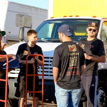 ProMen - Team members discussing upcoming job details to ensure a smooth and efficient moving experience. - Movers Near Me - San Diego, California ProMen - Team members discussing upcoming job details to ensure a smooth and efficient moving experience. - Movers Near Me - San Diego, California