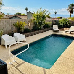 Poseidon Pools And Spas - This beautiful pool is the Praia 22 with a built in tanning ledge. It is 9'9" x 22'10"