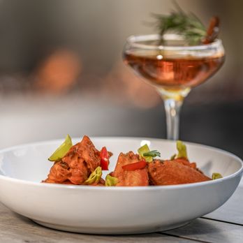 Fire Restaurant & Lounge - a bowl of food and a glass of wine - New American Near Me - Denver, Colorado