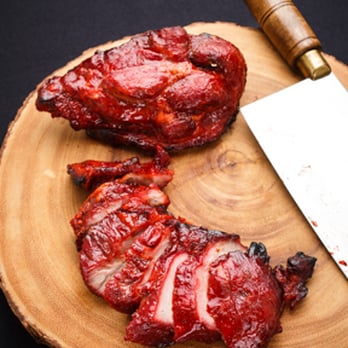 Rice Garden - a piece of meat on a cutting board with a knife - Chinese Near Me - Tucson, Arizona Rice Garden - a piece of meat on a cutting board with a knife - Chinese Near Me - Tucson, Arizona