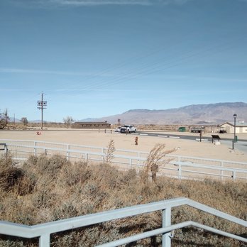 Manzanar National Historic Site - Standing on the steps of the visitors center looking toward Highway 395, you can see a replica guard tower in the distance - Landmarks & Historical Buildings Near Me - Independence, California