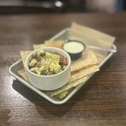 STACKED - Huntington Beach - Ahi Poke: sushi grade ahi tuna, poke sauce, avocado, green/red onion, sesame seeds, side of wonton chips & wasabi sauce | $16 (50% Off HH)