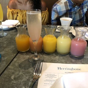 Herringbone Waikiki - Mimosa bar Five different juices-guava, POG, orange, pineapple and lilikoi - Seafood Near Me - Honolulu, Hawaii Herringbone Waikiki - Mimosa bar Five different juices-guava, POG, orange, pineapple and lilikoi - Seafood Near Me - Honolulu, Hawaii