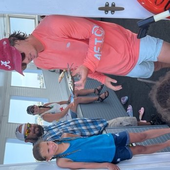 The Fun Boats Dolphin Cruises - Morgan showing the kids a blue crab - Boat Charters Near Me - Orange Beach, Alabama The Fun Boats Dolphin Cruises - Morgan showing the kids a blue crab - Boat Charters Near Me - Orange Beach, Alabama