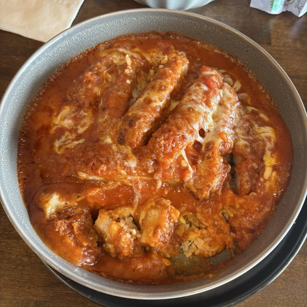 Pork chop with tomato sauce over rice Pork chop with tomato sauce over rice
