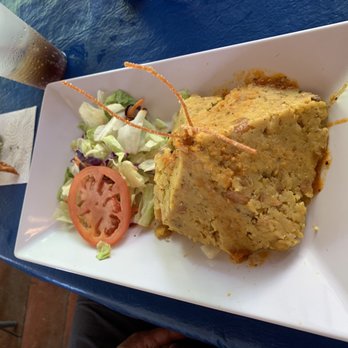 La Casita Martell - Mofongo (and a fried chicken wing on the left) - Bars Near Me - Bayamón, Puerto Rico La Casita Martell - Mofongo (and a fried chicken wing on the left) - Bars Near Me - Bayamón, Puerto Rico