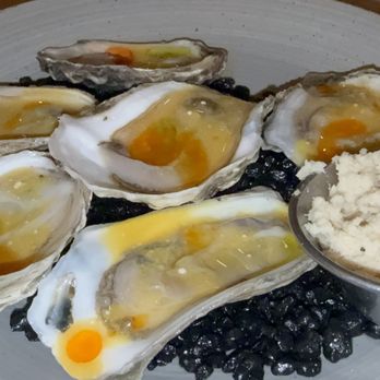 Red Rooster Overtown - OYSTERS ON THE HALF SHELL* oysters on the half shell are served chilled with tangy coco passion mignonette and fresh horseradish. - Cocktail Bars Near Me - Miami, Florida
