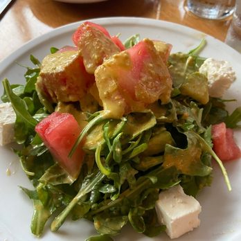 411 West Italian Cafe - Local Watermelon Salad. Cucumber, basil, arugula, feta, Sungold tomato vinaigrette. $8 small, $11 large. - Italian Near Me - Chapel Hill, North Carolina